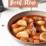 bowl of guinness beef stew with herbs besides.