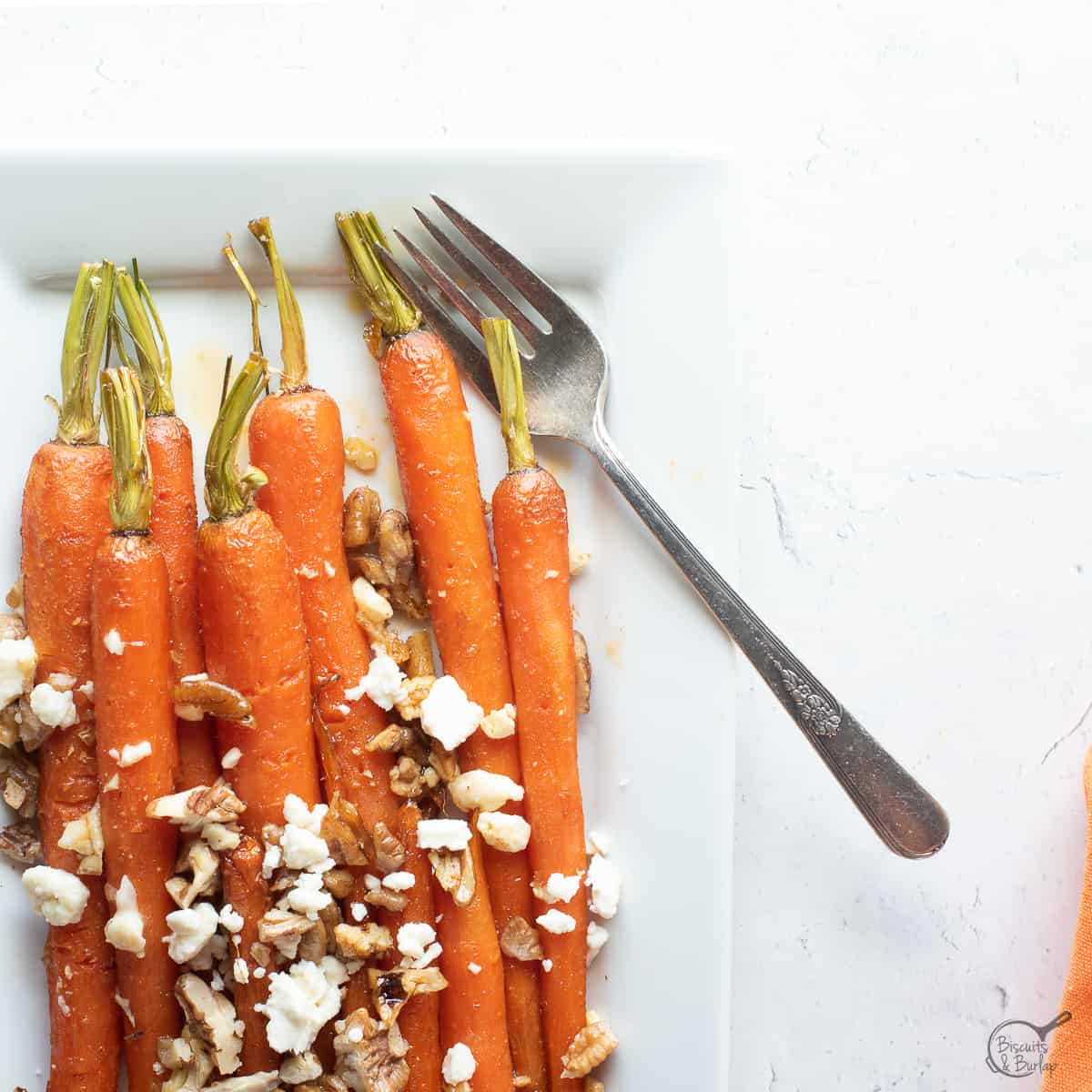 square image of honey glazed carrots.