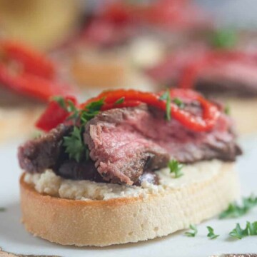 square image of steak crostini.