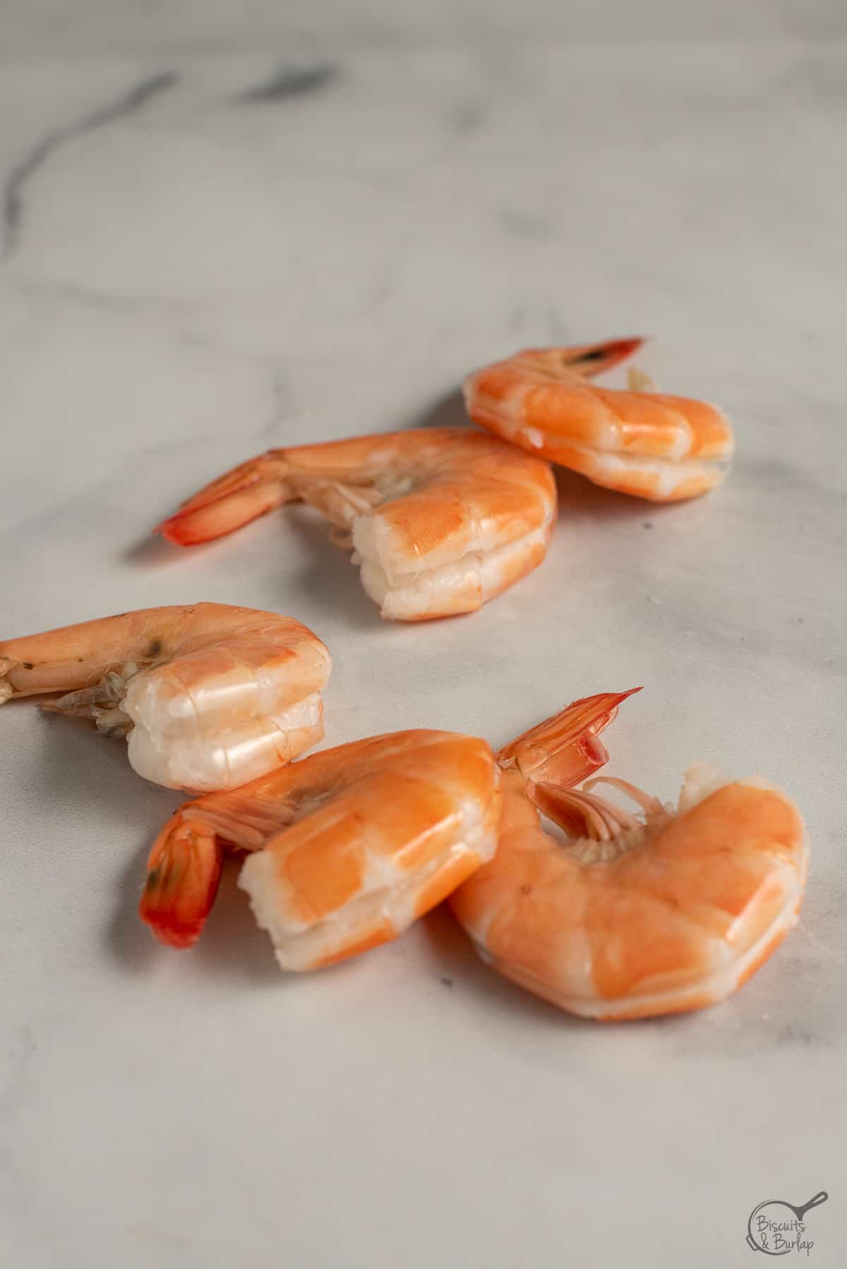 cooked shrimp deveined but with shells on.