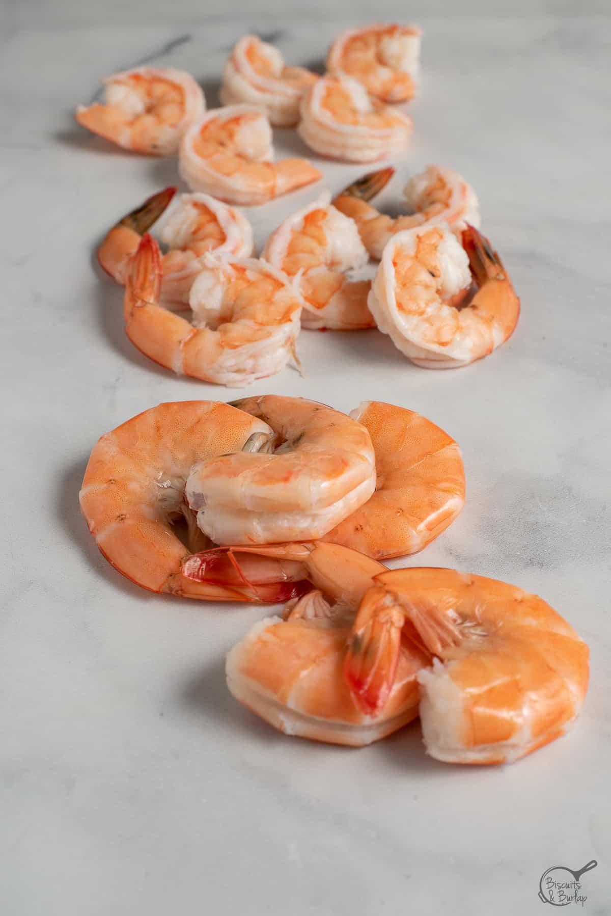 shrimp deveined but with shells and tails on, tails on, fully cleaned.