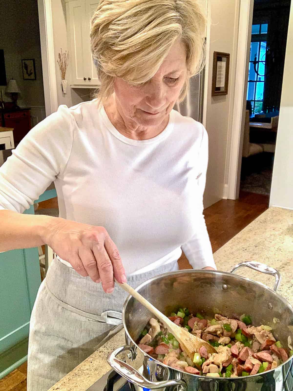 woman cooking jambalaya.