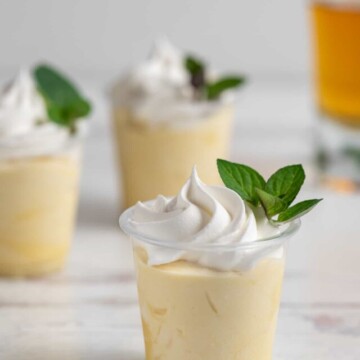 Mint julep pudding shots on white background