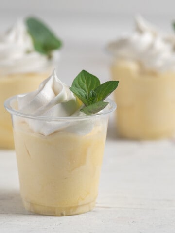 Mint julep pudding shots on white background