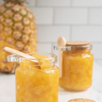 poster image showing pineapple and preserves in jars.