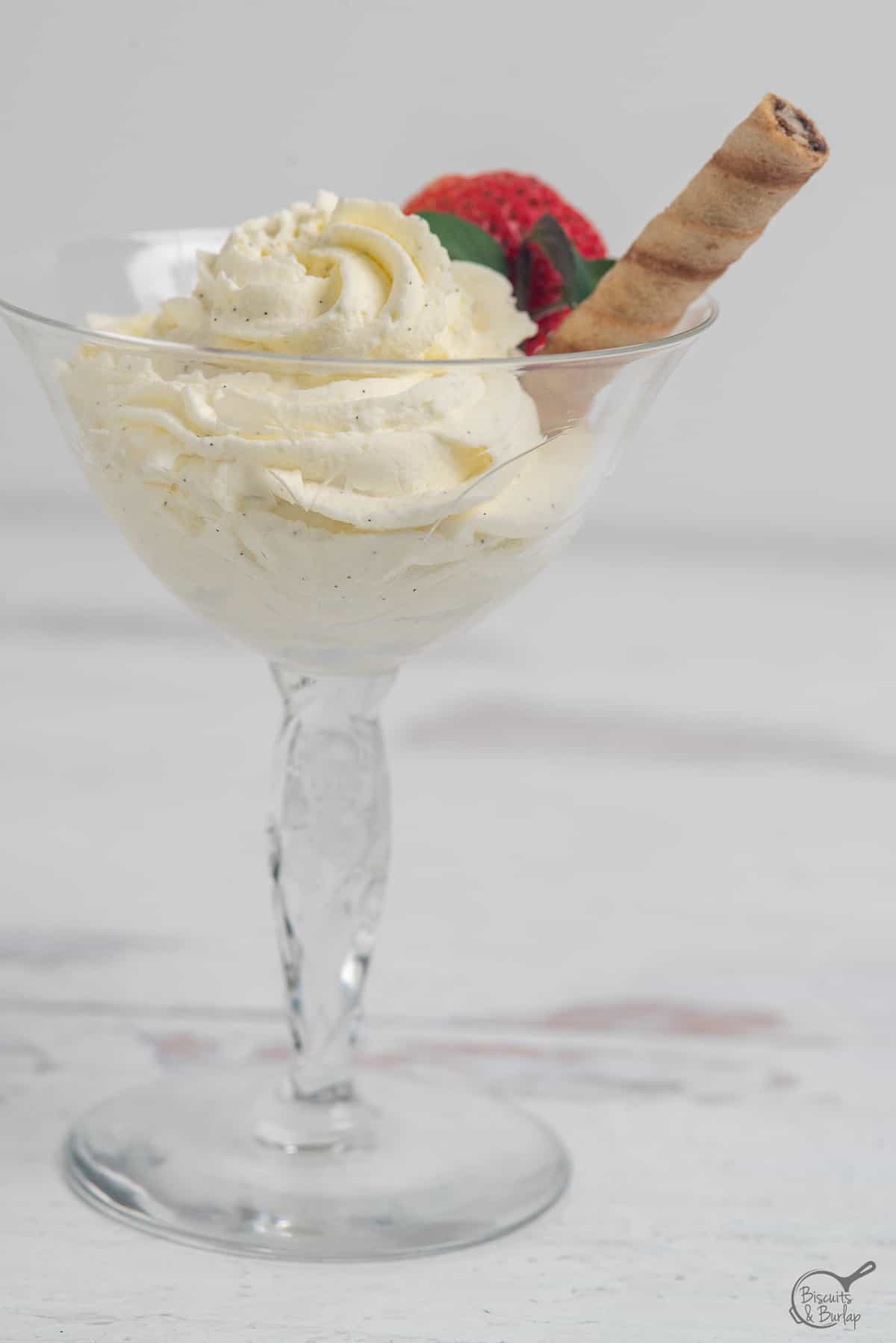mousse with cookie in crystal glass.