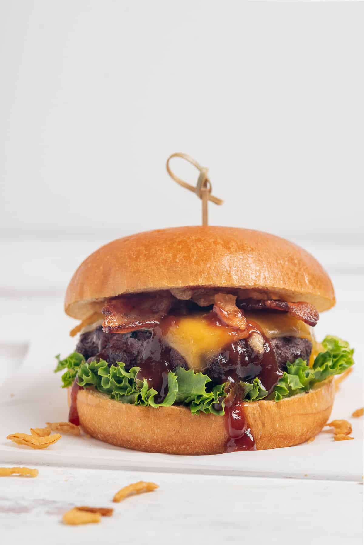 Bourbon Bacon Cheeseburger on white background