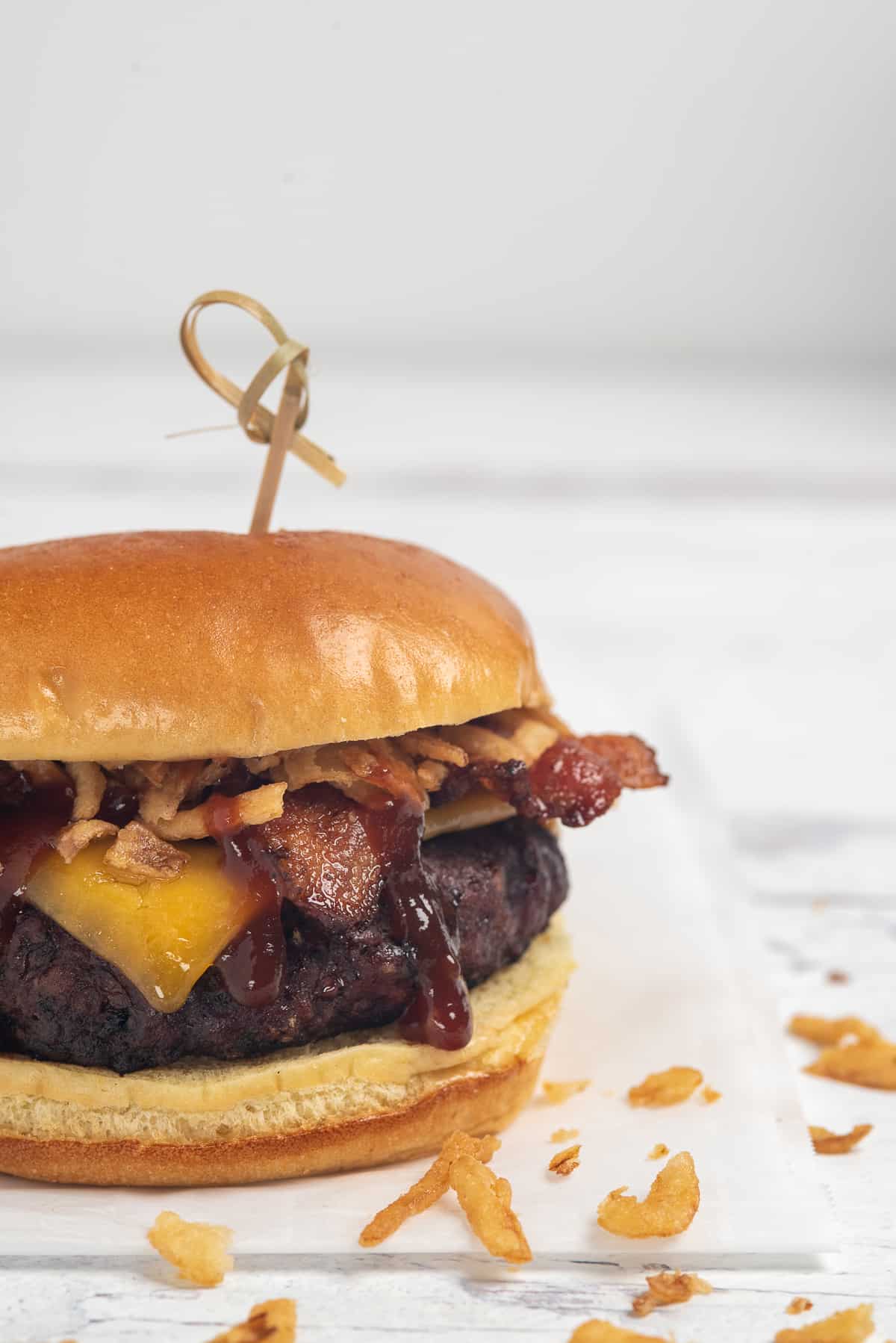 Bourbon Bacon Cheeseburger on white background