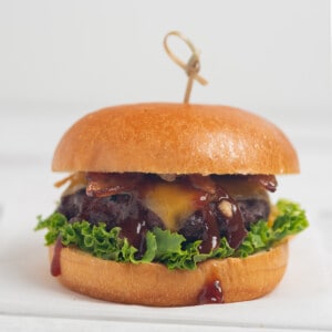 Bourbon Bacon Cheeseburger on white background