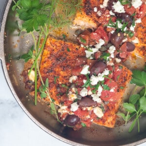 greek salmon in skillet.