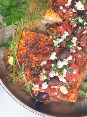 greek salmon in skillet.