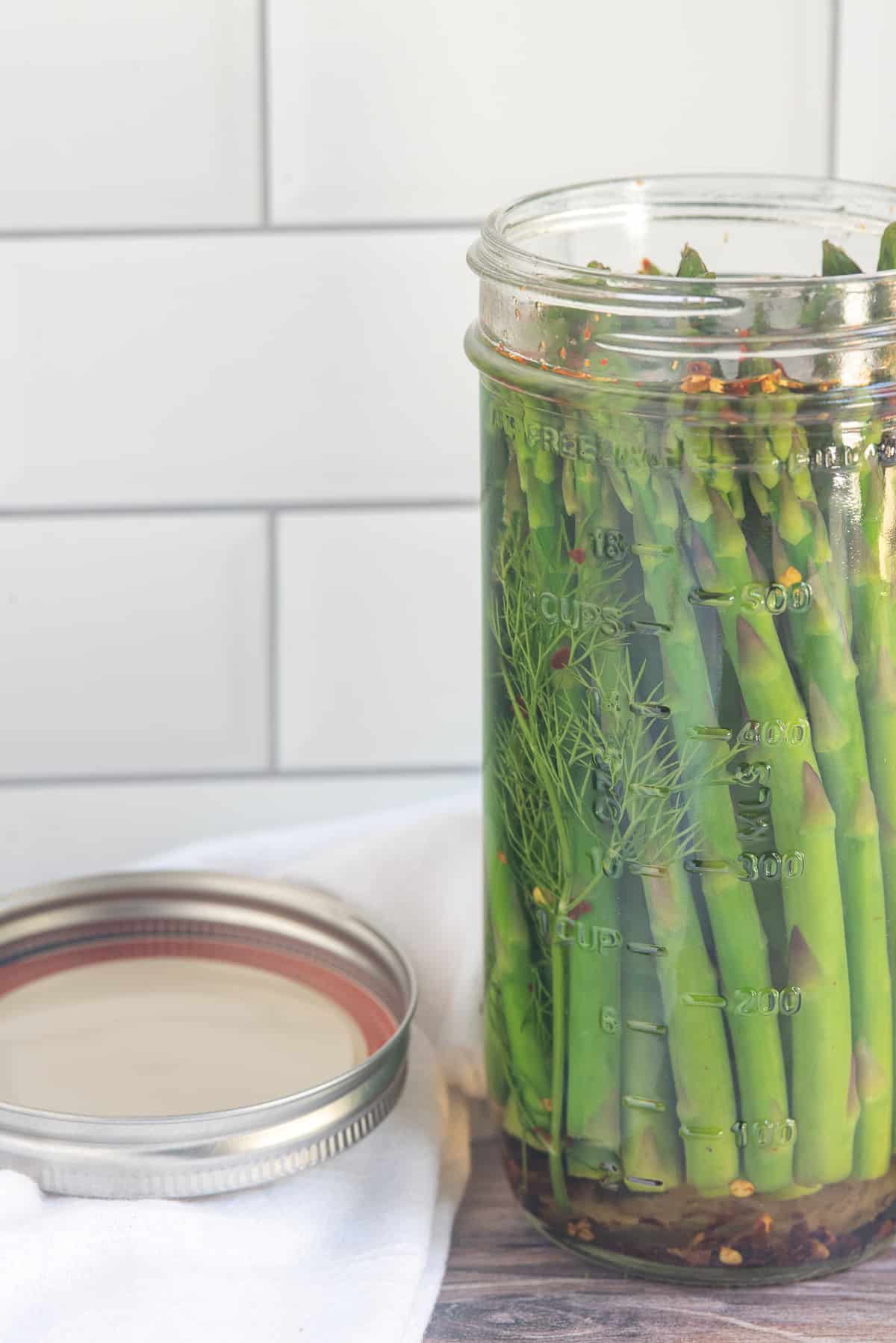 open jar of pickled asparagus. 