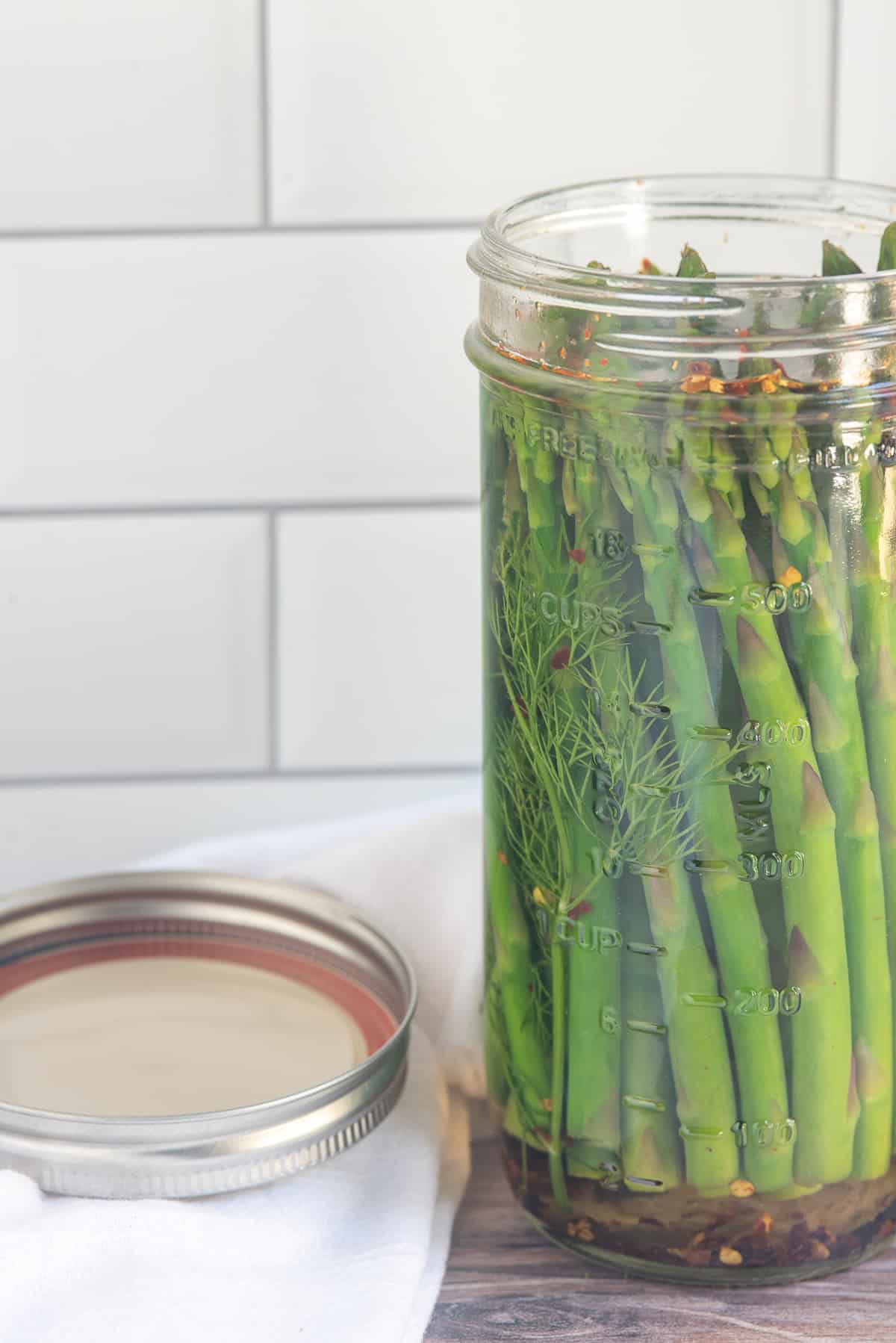 open jar of pickled asparagus.
