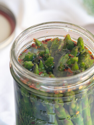 looking into top of jar of quick pickled asparagus.