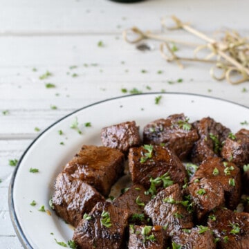 cajun steak bites on plate.