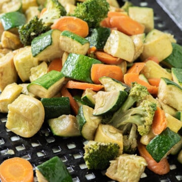 smoked vegetables on grill basket.