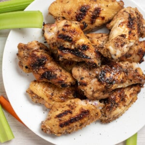 honey lemon pepper wings on plate.