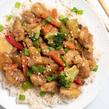 Honey bourbon chicken on white plate
