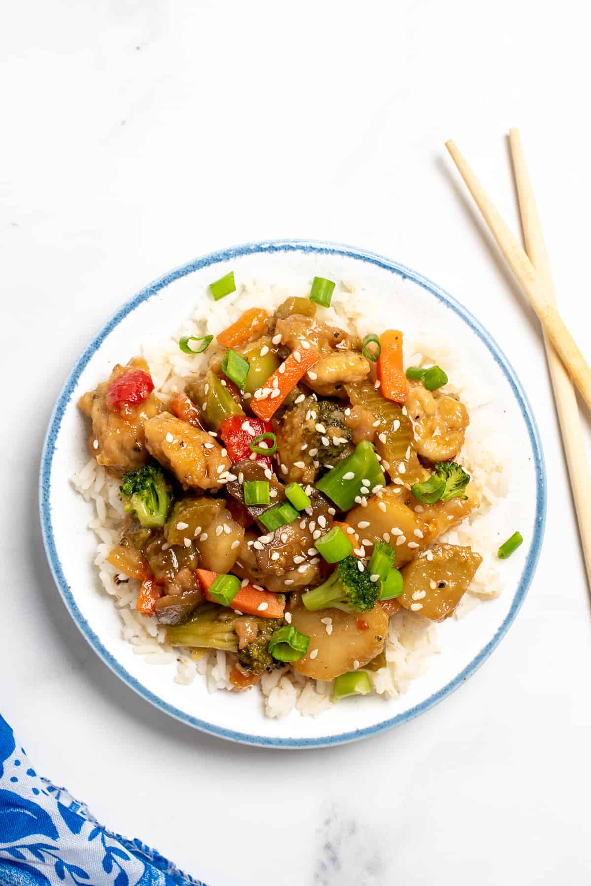 Honey bourbon chicken on white plate with white background