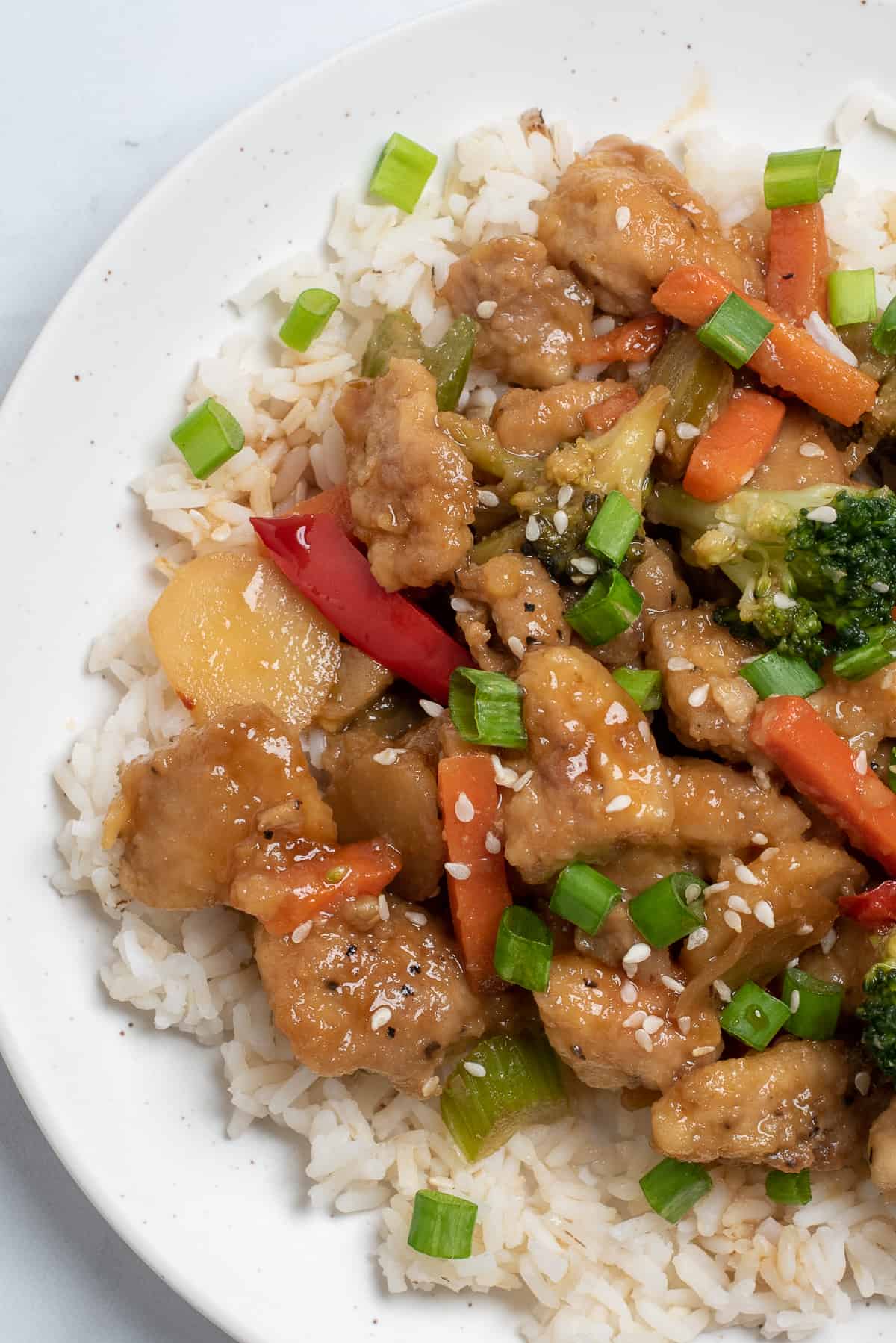 Honey bourbon chicken on white plate