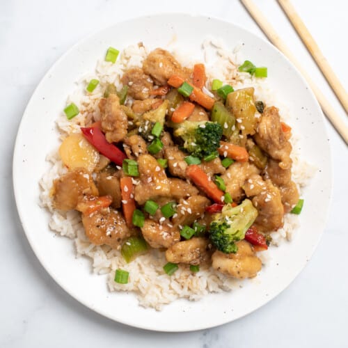 Honey bourbon chicken on white plate