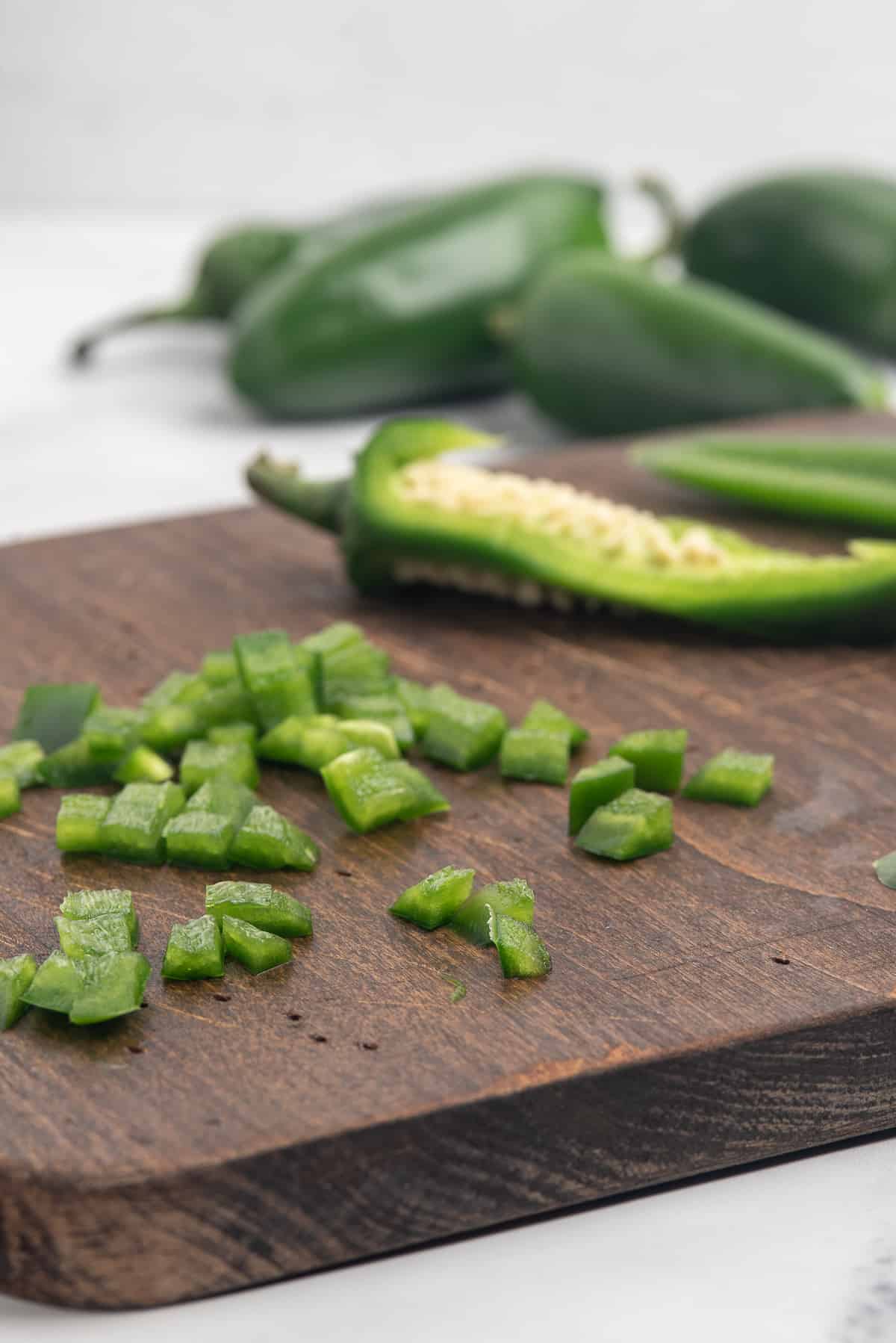 Diced jalapeno on cutting board.