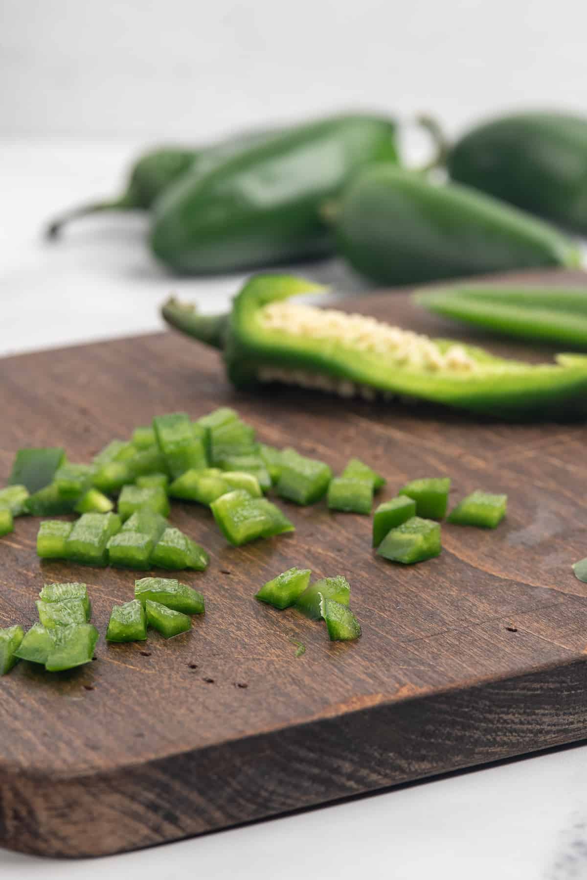 Diced jalapeno on cutting board. 