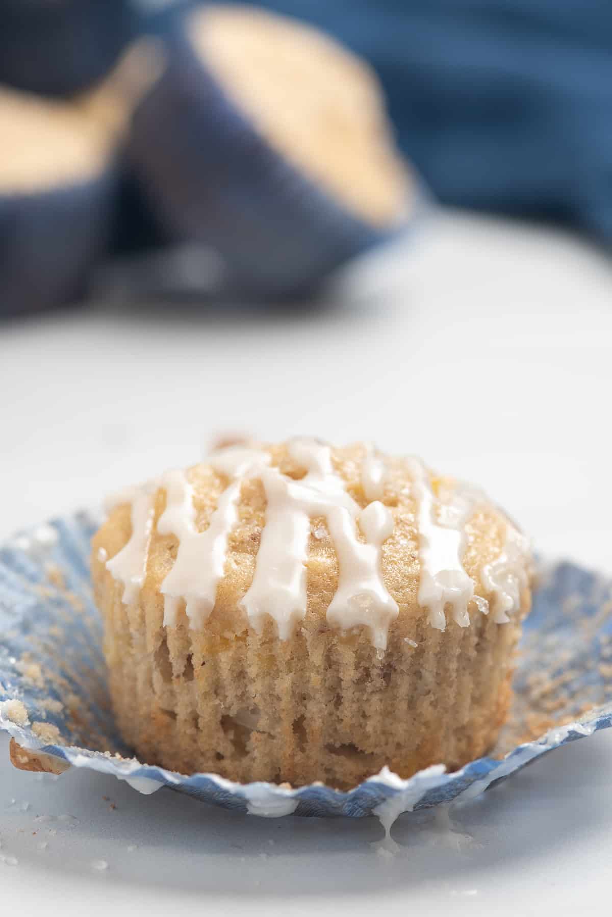 muffin with paper liner pulled down.
