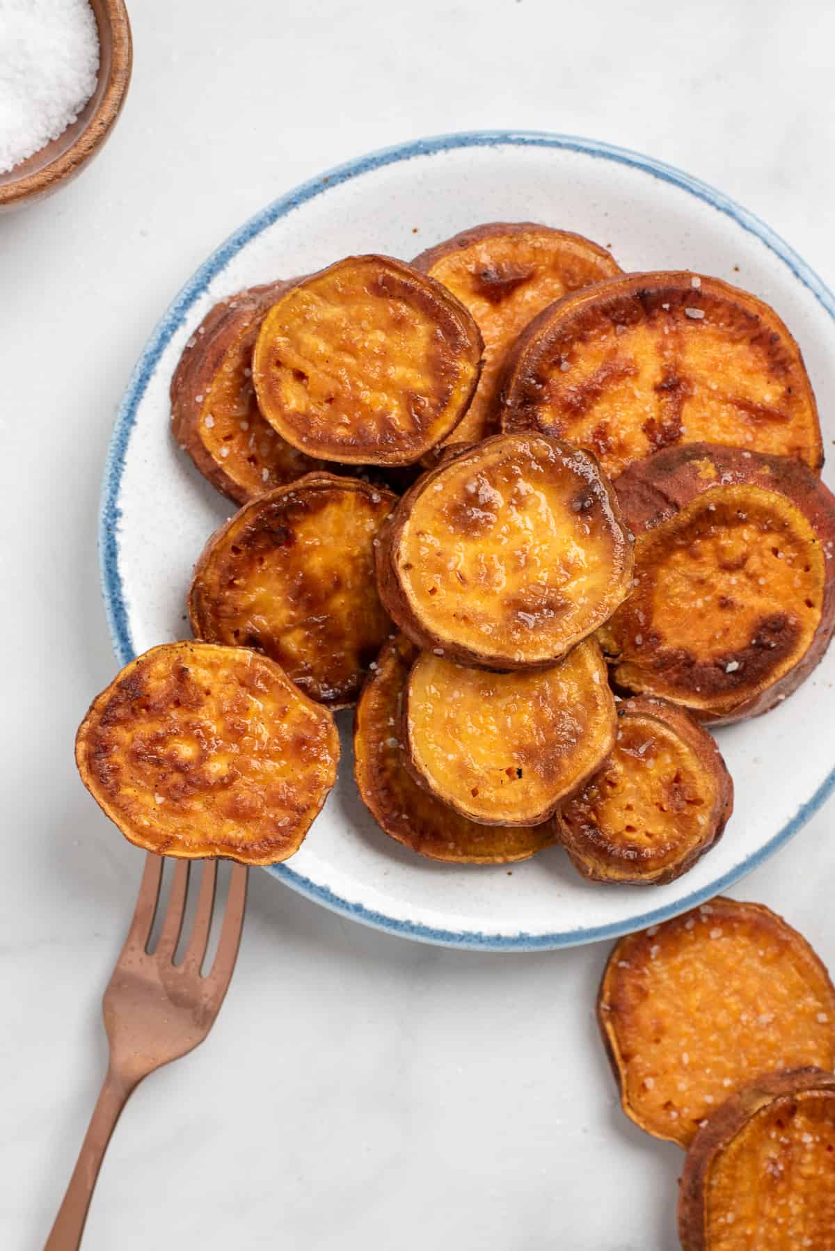 pan fried sweet potatoes with one on fork. 