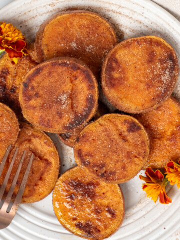 square image of pan friend sweet potatoes with small flowers.