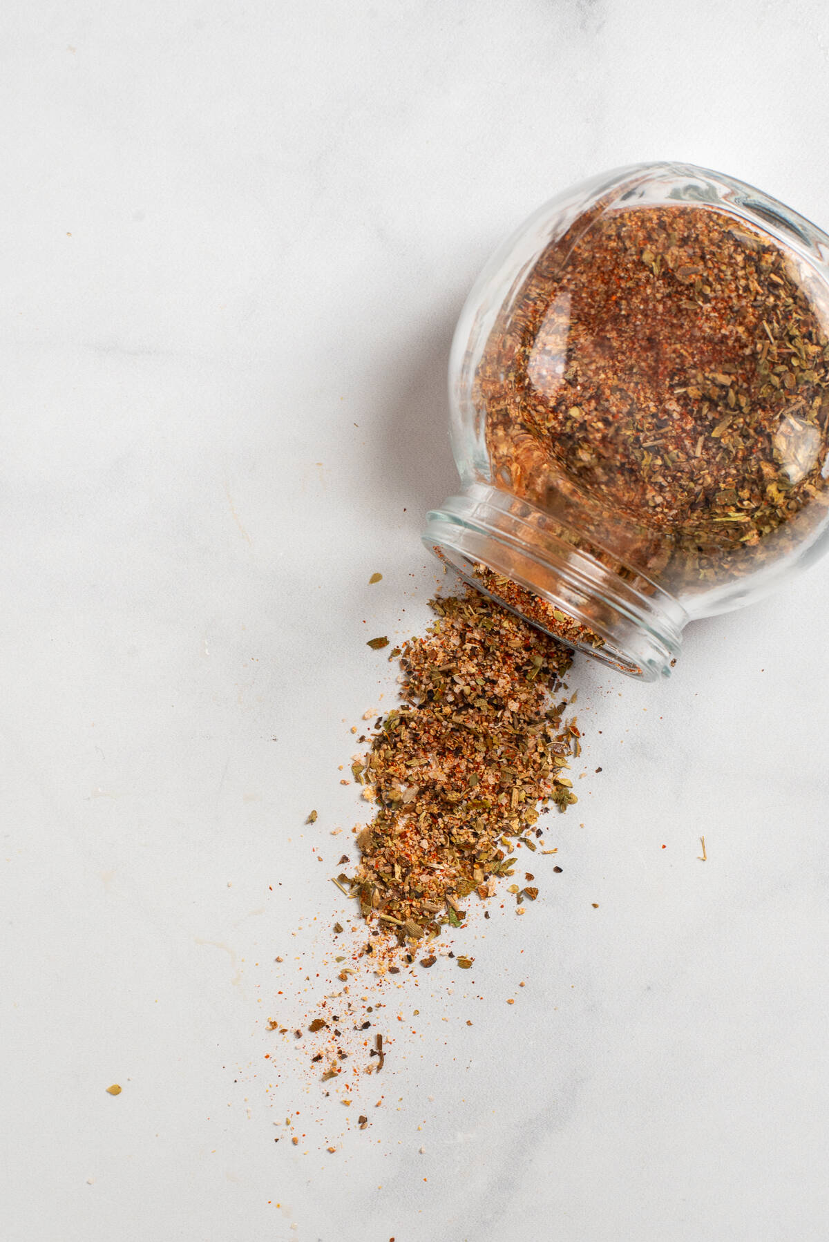 blackened seasoning coming out of jar on counter.