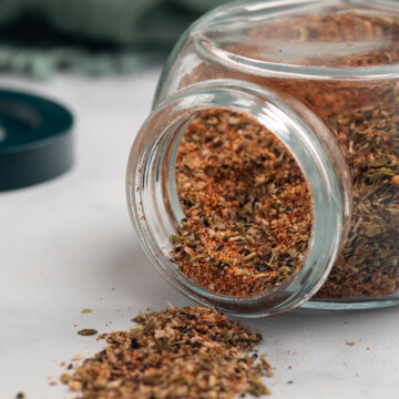 blackened seasoning spilling out of jar.