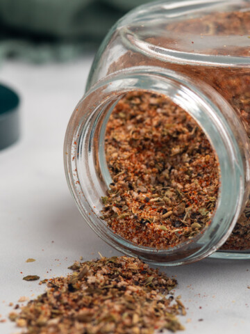 blackened seasoning spilling out of jar.