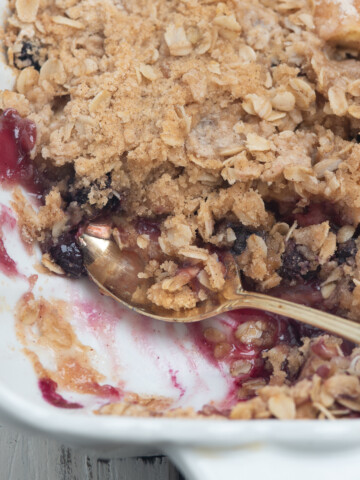 apple berry crisp with spoon.