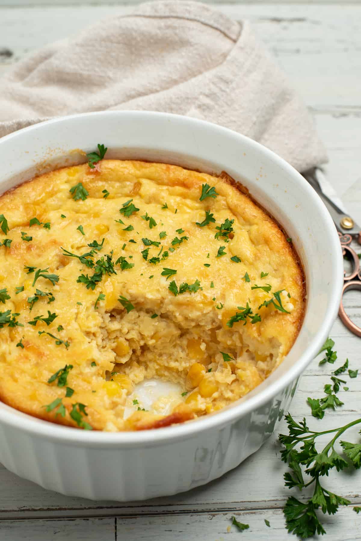 corn souffle with parsley garnish.