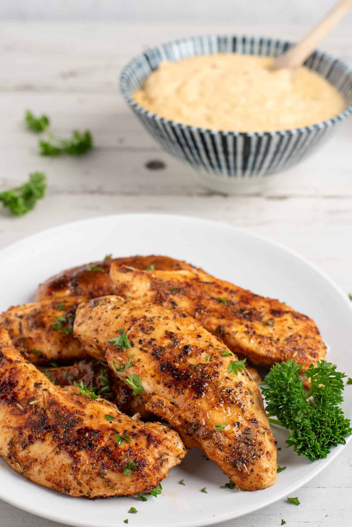 chicken and grits in separate containers. 