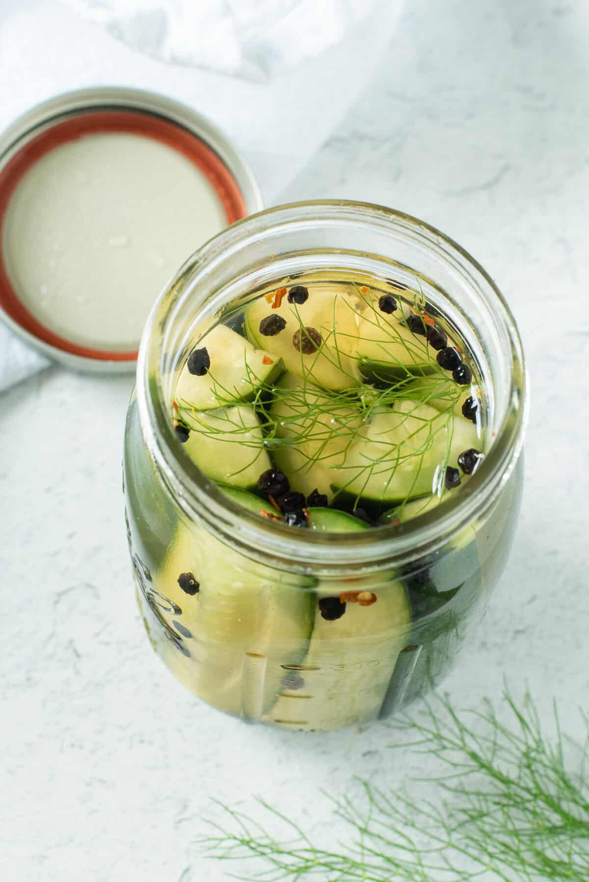 overhead shot of open jar of pickles.