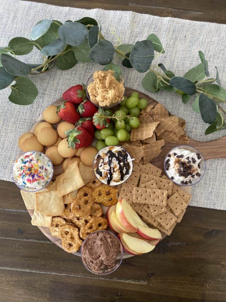 dessert dips on board with cookies.