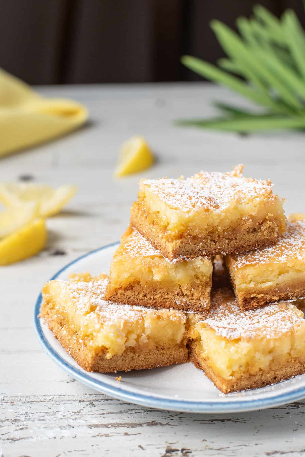 lemon gooey butter cake servings on plate.