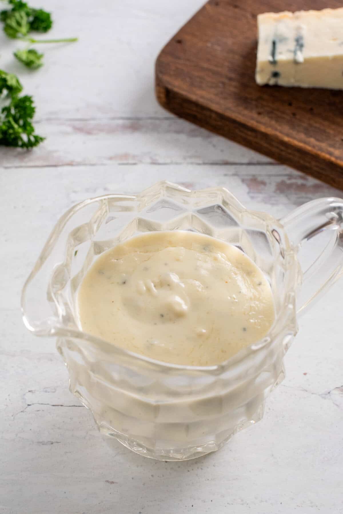 a glass dish full of gorgonzola cream sauce