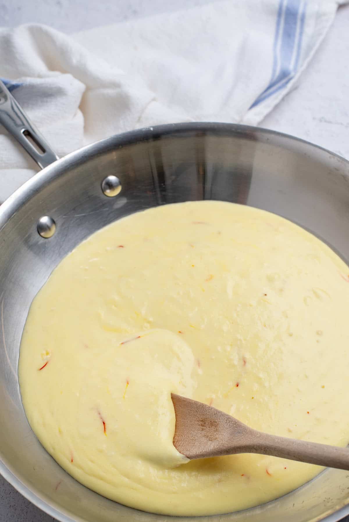 creamy saffron sauce in skillet.