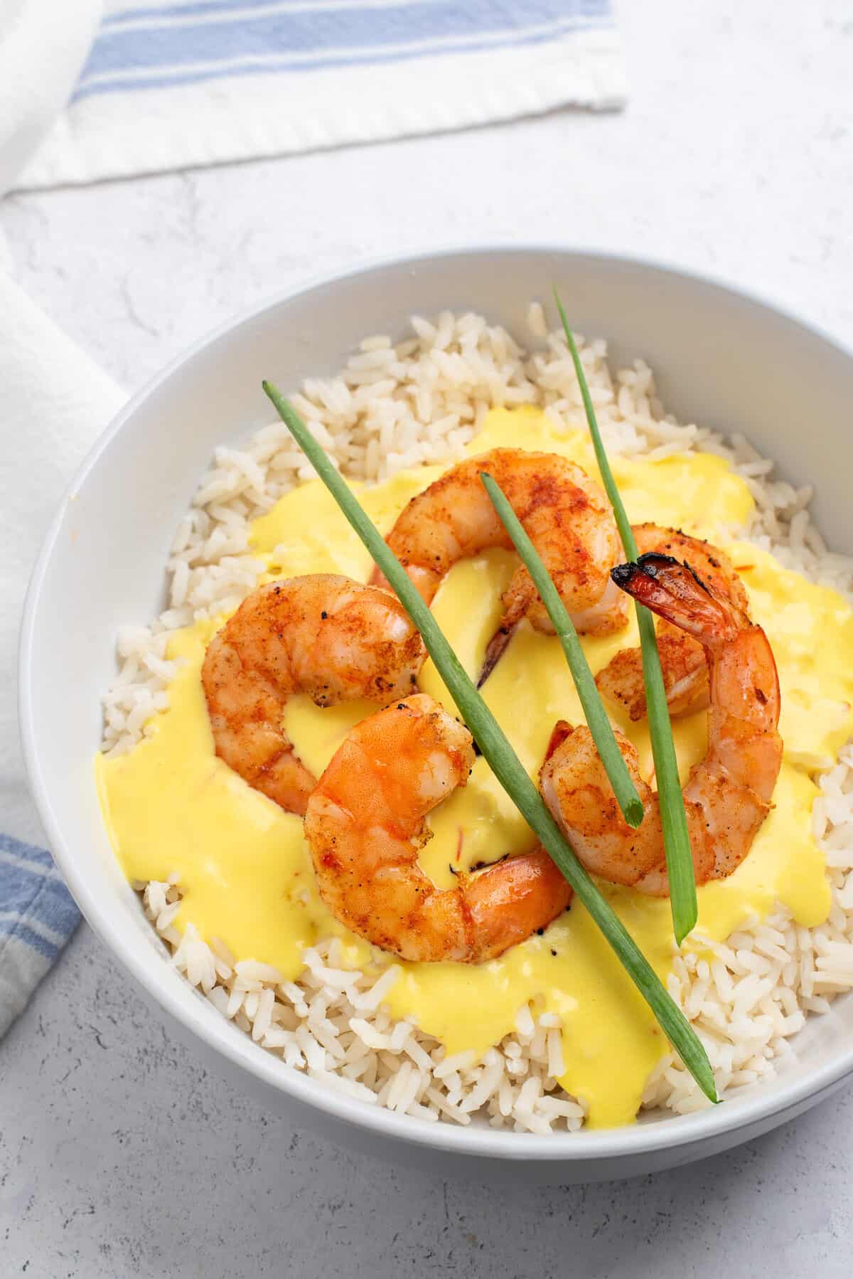 saffron cream sauce over rice with shrimp.