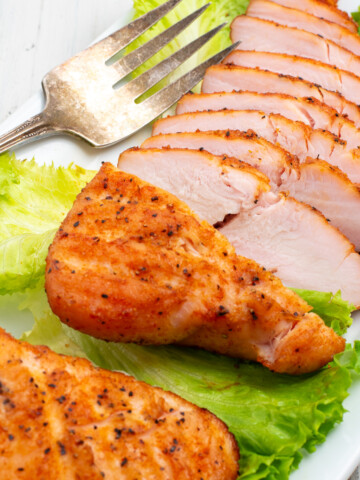 smoked turkey tenderloin on plate.