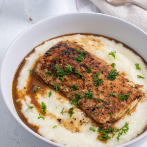 square image of fish and grits.