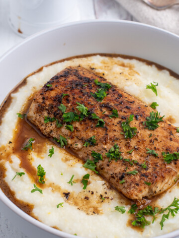 square image of fish and grits.