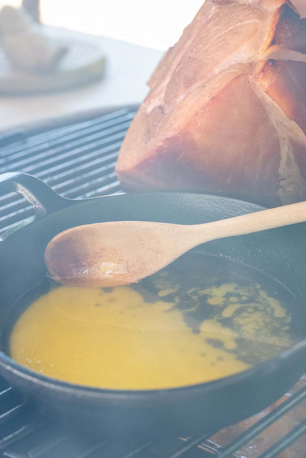 melted butter being stirred with smoke around.