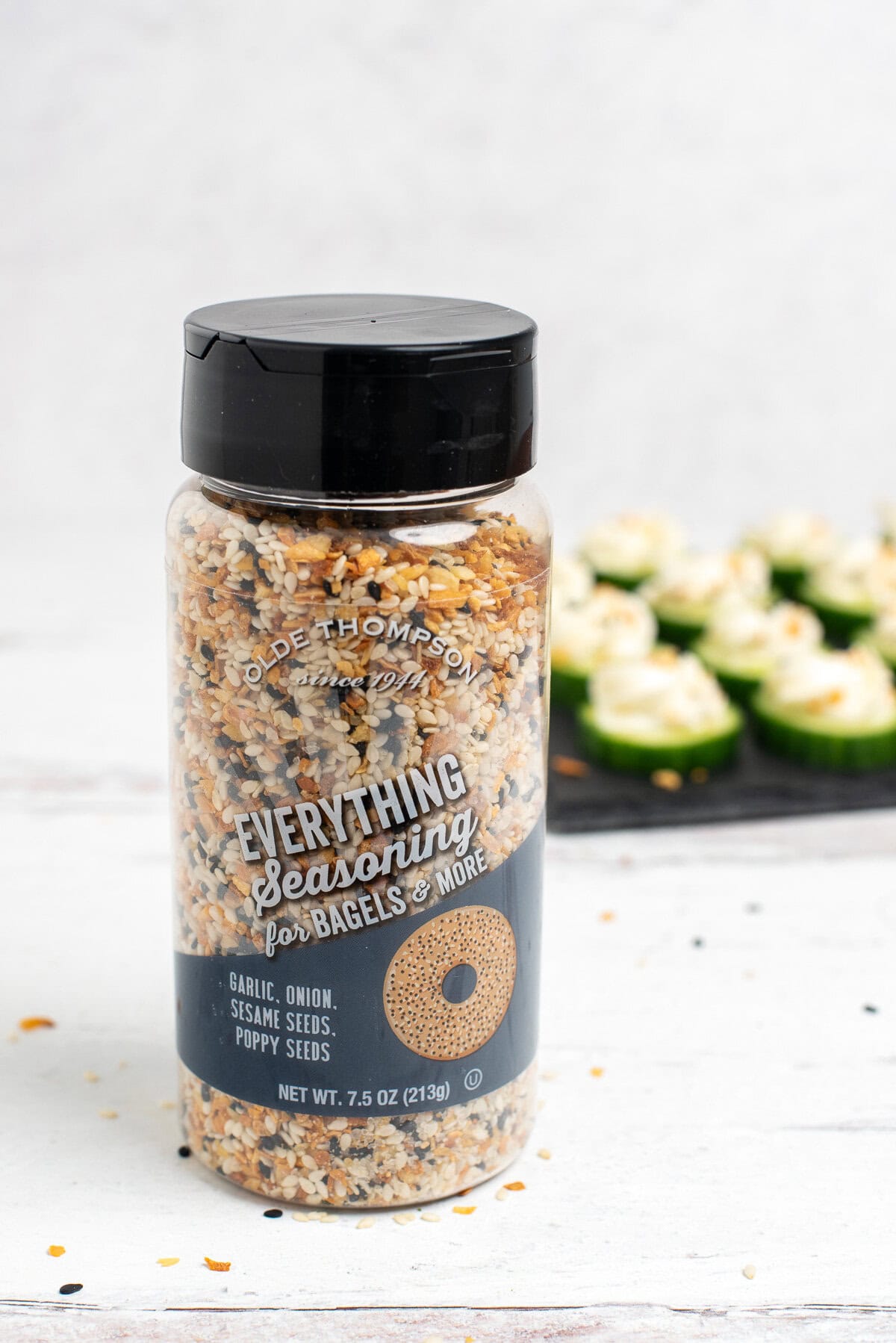 Everything bagel seasoning with cucumber bites behind.