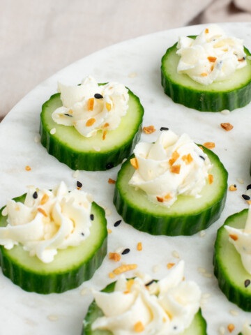 cream cheese cucumber bites on plate.