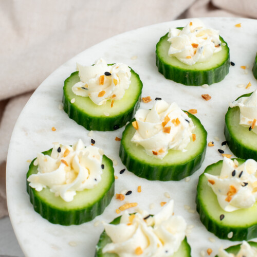 cream cheese cucumber bites on plate.