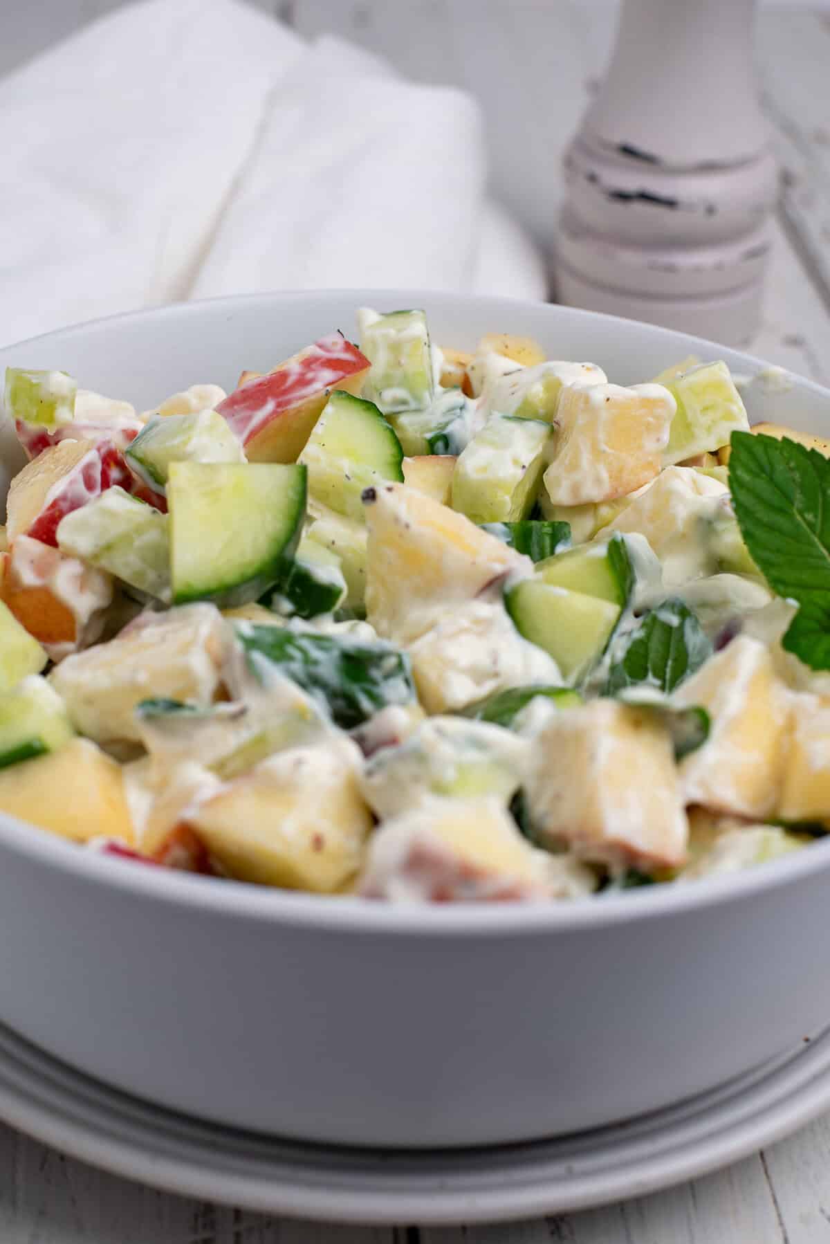 cucumber salad with apples tossed on yogurt dressing